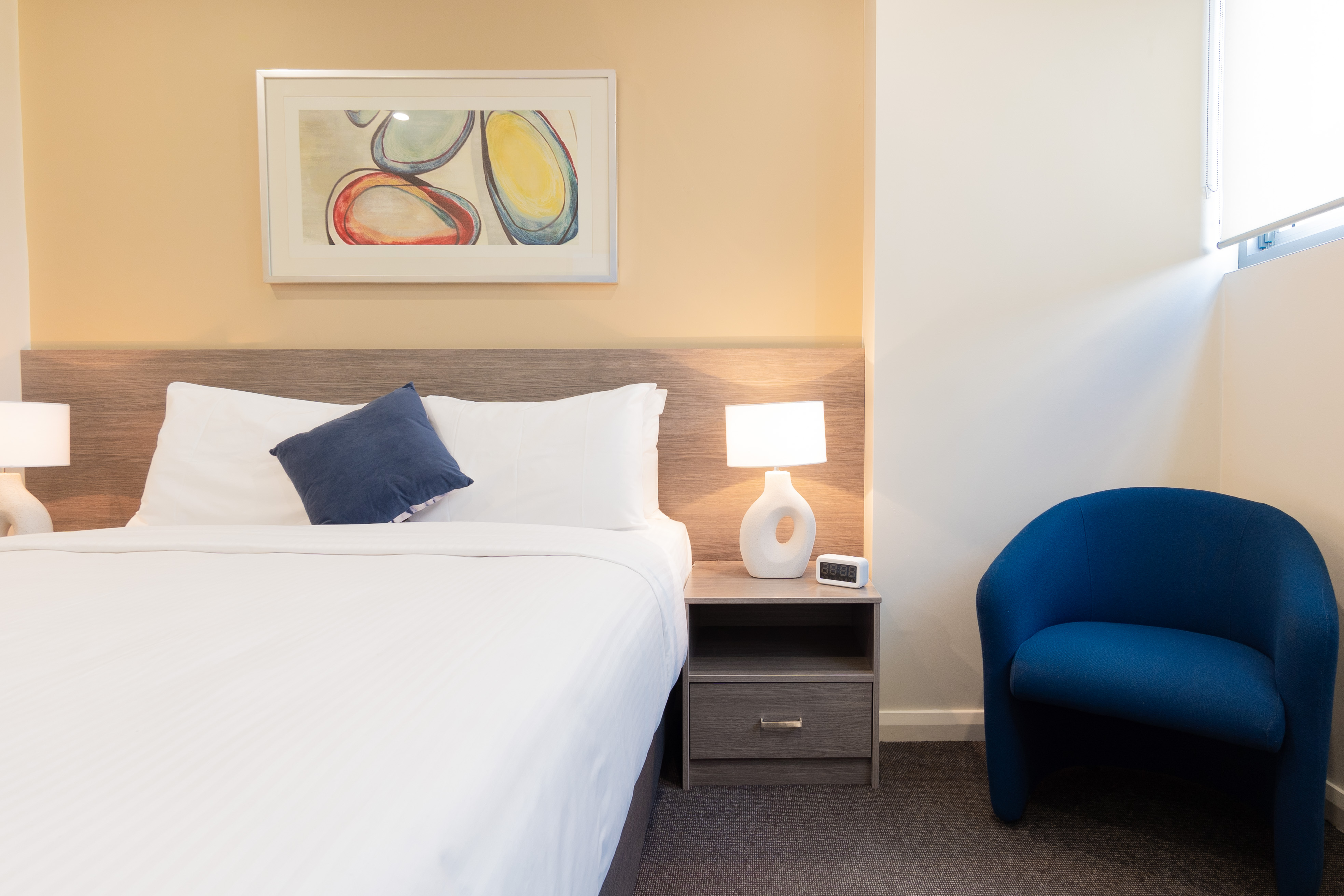 Comfortable queen bed in the standard queen room at BW Plus Camperdown Suites Sydney